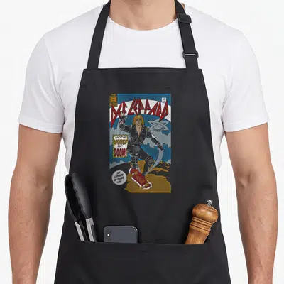 Tablier de cuisine noir avec une illustration de style comic book représentant un chanteur rock sur une planche à roulettes.