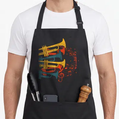 Tablier de cuisine noir avec illustration vintage de trois trompettes superposées et des notes de musique s'élevant en courbe rouge.