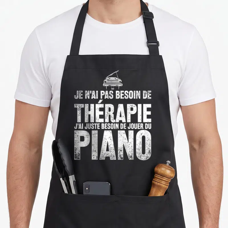 Tablier de cuisine noir avec inscription blanche Je n'ai pas besoin de thérapie jouer du piano et illustration de piano à queue.