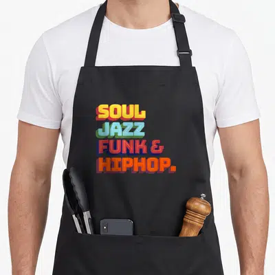 Tablier de cuisine noir avec inscription colorée Soul Jazz Funk et Hip Hop en typographie rétro.