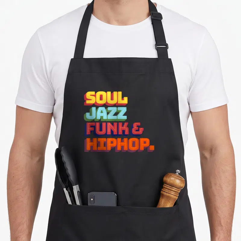 Tablier de cuisine noir avec inscription colorée Soul Jazz Funk et Hip Hop en typographie rétro.