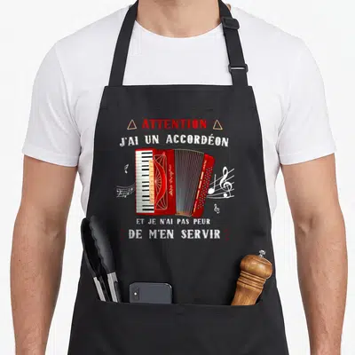 Tablier de cuisine noir avec illustration d'accordéon rouge et texte Attention j'ai un accordéon et je n'ai pas peur de m'en servir