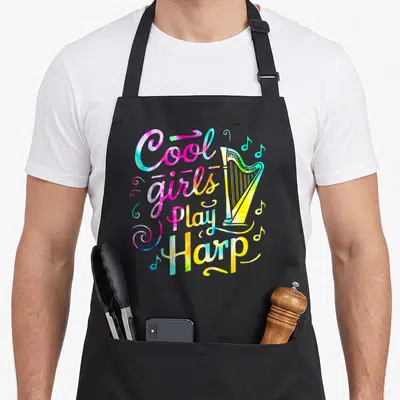Tablier de cuisine noir avec inscription Cool Girls Play Harp et illustration de harpe multicolore tie-dye.