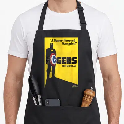Tablier de cuisine noir avec affiche jaune Rogers The Musical et silhouette portant un bouclier.
