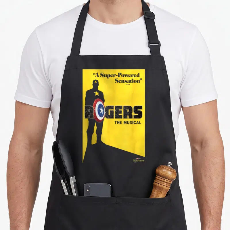 Tablier de cuisine noir avec affiche jaune Rogers The Musical et silhouette portant un bouclier.