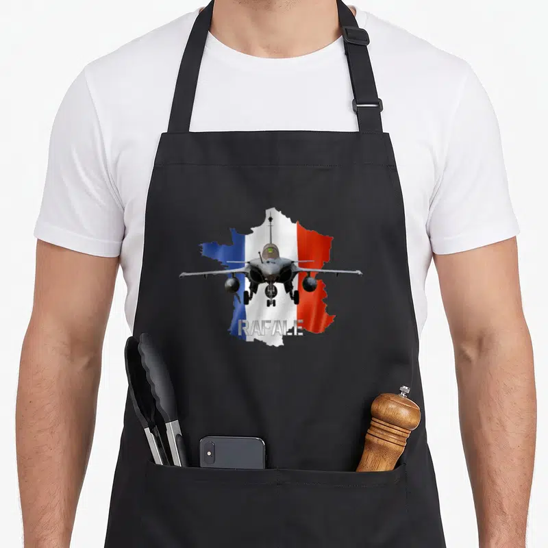 Tablier de cuisine noir avec avion Rafale de face sur carte France tricolore et texte Rafale en bas.