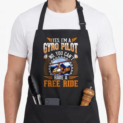 Tablier de cuisine noir avec illustration de gyrocoptère orange et texte blanc Yes I'm a Gyro Pilot No You Can't Have A Free Ride.