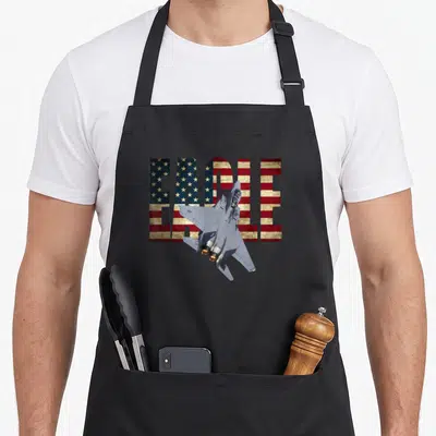 Tablier de cuisine noir avec illustration F-15 Eagle et texte EAGLE au motif drapeau américain.