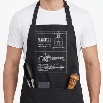 Tablier de cuisine noir avec les plans techniques blancs de l'hélicoptère Alouette II.