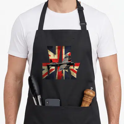 Tablier de cuisine noir avec illustration VE Day, drapeau Union Jack et avion Lancaster vintage.