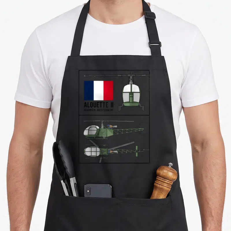Tablier de cuisine noir avec schéma technique de l'hélicoptère Alouette II et drapeau français.