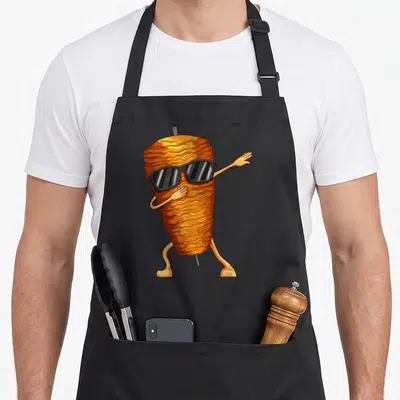 Tablier de cuisine noir avec une illustration de doner brochette de kebab avec lunettes de soleil en train de danser.