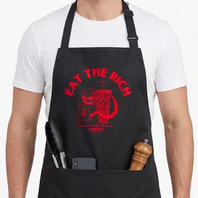 Tablier de cuisine noir avec illustration rouge de Karl Marx taillant un döner avec une faucille sous le texte Eat the Rich.