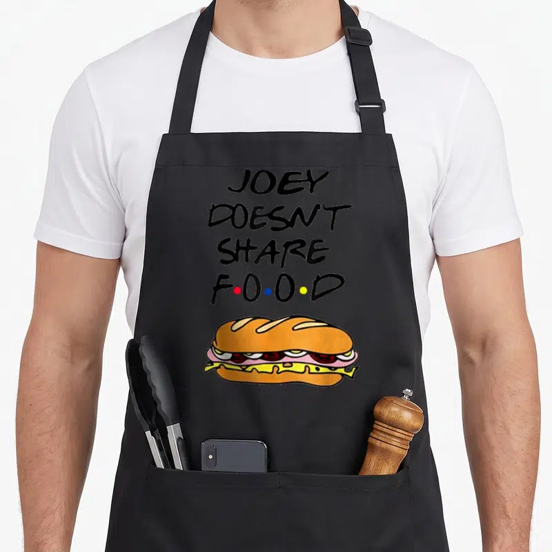 Tablier de cuisine noir avec inscription Joey ne partage pas les hamburgers alimentaires et illustration de sandwich au fromage.