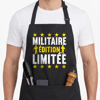 Tablier de cuisine noir avec inscription « Militaire Édition Limitée », étoiles jaunes et silhouettes de soldats en tenue.