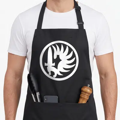 Tablier de cuisine noir avec l'insigne circulaire blanc de la Légion étrangère français.