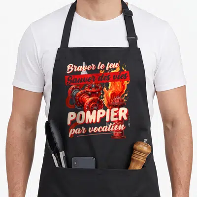 Tablier de cuisine noir avec illustration de tuyau rouge, flammes et texte Pompier par vocation