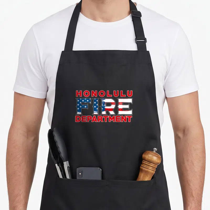 Tablier de cuisine noir avec l'inscription Honolulu Fire Department en rouge, blanc et bleu étoilé.
