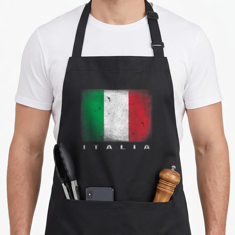 Tablier de cuisine noir avec drapeau italien Italia vert blanc et rouge style aérographe et texte blanc en dessous.