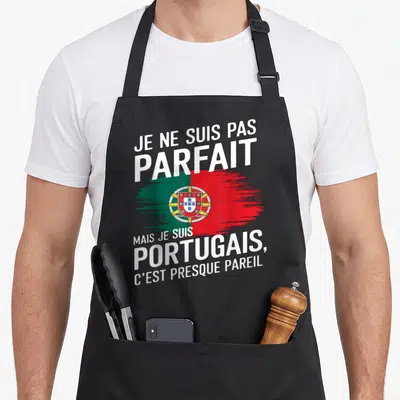 Tablier de cuisine noir avec le drapeau du Portugal et le texte Je ne suis pas parfait mais Portugais en blanc.