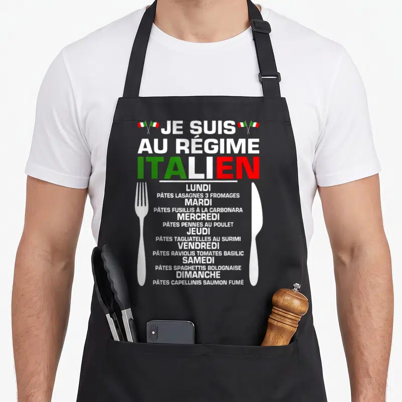 Tablier de cuisine noir avec menu hebdomadaire de pâtes et ustensiles de table blancs imprimés sur le devant.