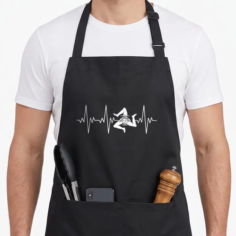 Tablier de cuisine noir avec un motif blanc représentant une ligne de pouls traversant la figure de la Trinacria sicilienne.