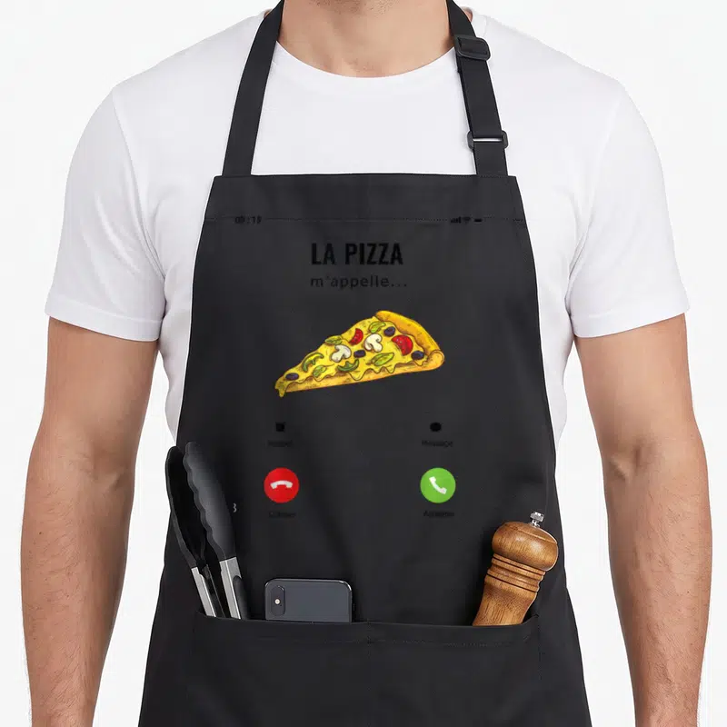 Tablier de cuisine noir avec une illustration d'écran de téléphone montrant une pizza et les options Refuser ou Accepter.
