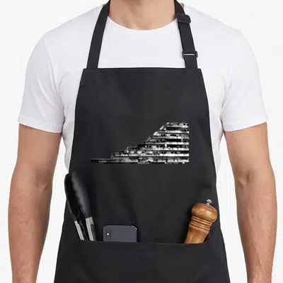 Tablier de cuisine noir avec une impression graphique en noir et blanc représentant les tours des Vele Di Scampia à Naples, Italie.
