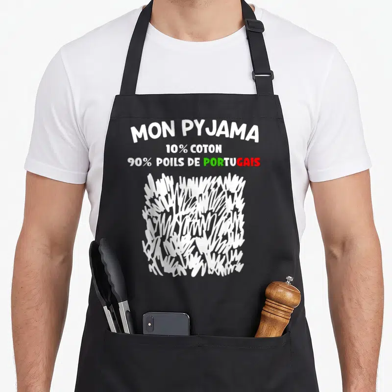 Tablier de cuisine noir avec inscription Mon Pyjama et illustration de poils blancs stylisés.