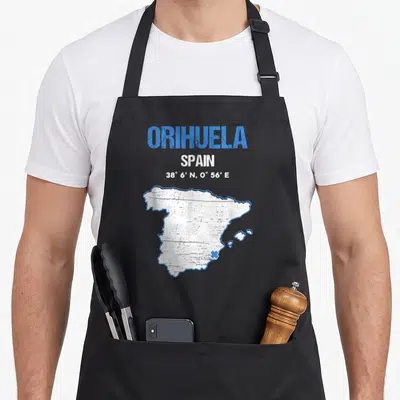 Tablier de cuisine noir avec une carte stylisée de l'Espagne et le texte Orihuela Spain en haut.