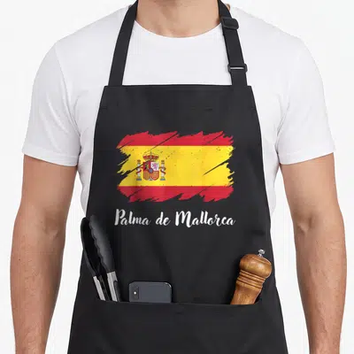 Tablier de cuisine noir avec une illustration du drapeau espagnol et le texte Palma de Mallorca en blanc.