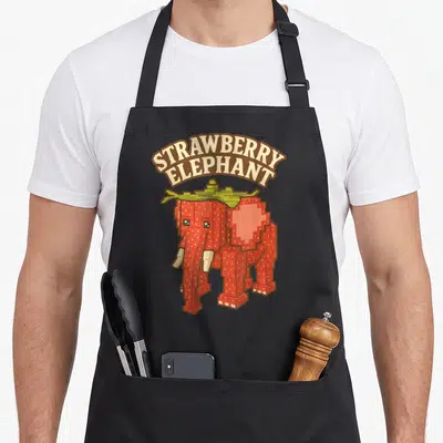 Tablier de cuisine noir avec un éléphant fraise pixelisé portant le texte Strawberry Elephant en arc de cercle au-dessus.