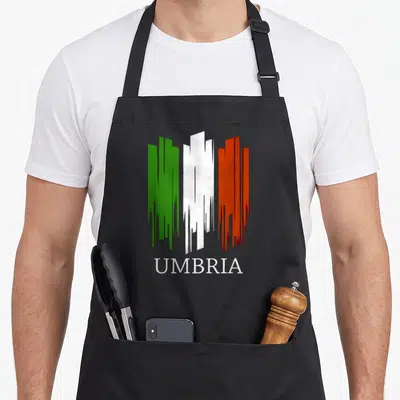 Tablier de cuisine noir avec un drapeau stylisé vert blanc rouge et le mot Umbria en lettres blanches.
