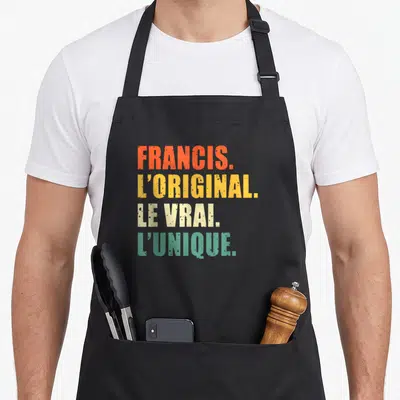 Tablier de cuisine noir avec inscription Francis l'original le vrai unique en lettres colorées.