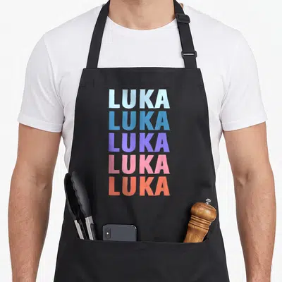Tablier de cuisine noir avec le prénom LUKA répété cinq fois en lettres capitales aux couleurs pastel.