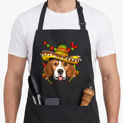 Tablier de cuisine noir avec illustration d'un beagle en sombrero, maracas et guirlandes festives.