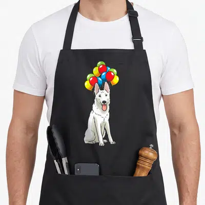 Tablier de cuisine noir avec illustration d'un chien blanc tenant des ballons colorés dans sa bouche