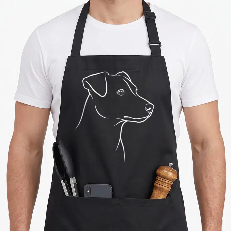 Tablier de cuisine noir avec portrait stylisé au trait blanc d'un chien Jack Russell Terrier de profil.