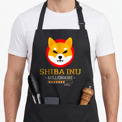 Tablier de cuisine noir avec tête de Shiba Inu, texte SHIBA INU MILLIONNAIRE et barre de chargement loading...