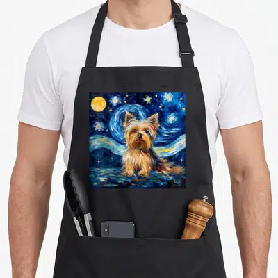 Tablier de cuisine noir avec illustration d'un Biewer Yorkshire Terrier sur fond de nuit étoilée bleue et jaune.