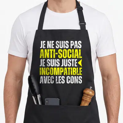 Tablier de cuisine noir avec inscription Je ne suis pas anti-social incompatible avec les cons en blanc et jaune.