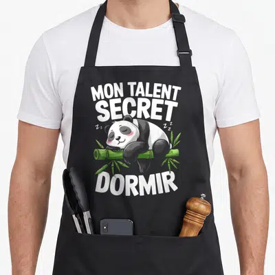 Tablier de cuisine noir avec illustration d'un panda dormant sur du bambou et le texte Mon Talent Secret Dormir en blanc.