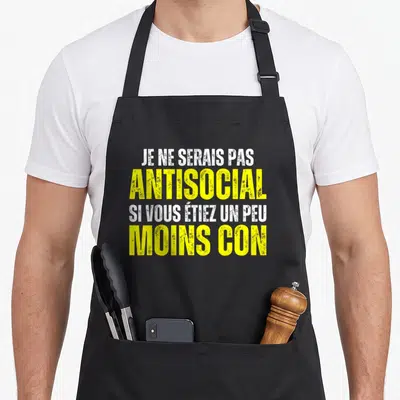 Tablier de cuisine noir avec inscription Je ne serais pas antisocial si vous étiez un peu moins con en jaune et blanc.