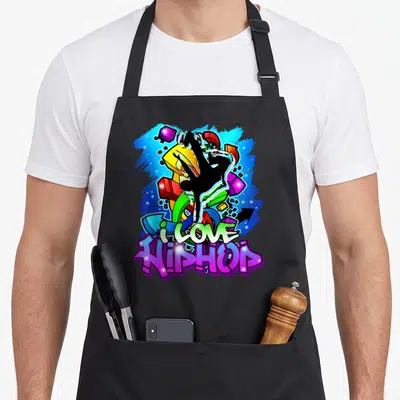 Tablier de cuisine noir avec illustration graffiti colorée et silhouette beatboxer au centre.