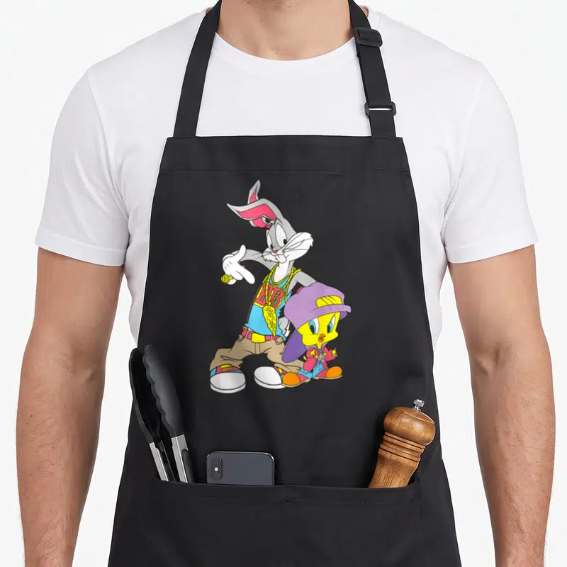 Tablier de cuisine noir avec Bugs Bunny et Tweety déguisés en rappeurs hip hop colorés.
