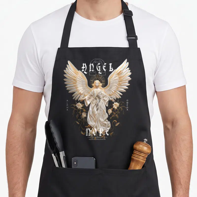 Tablier de cuisine noir avec une illustration d'ange aux ailes dorées et le texte Angel Nope Alpha Omega.