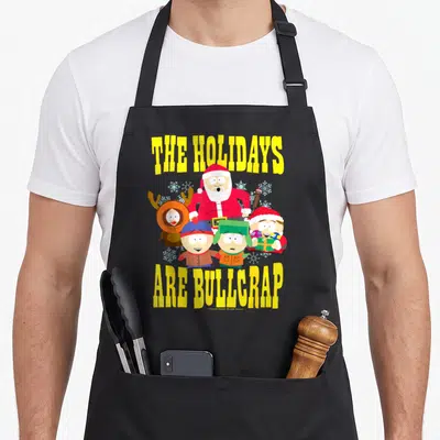 Tablier de cuisine noir avec les personnages de South Park et le texte The Holidays Are Bullcrap en jaune vif.