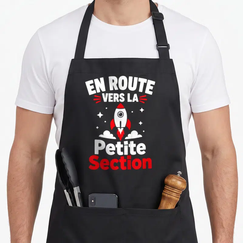 Tablier de cuisine noir avec illustration fusée rouge et blanc et texte En route vers la Petite Section