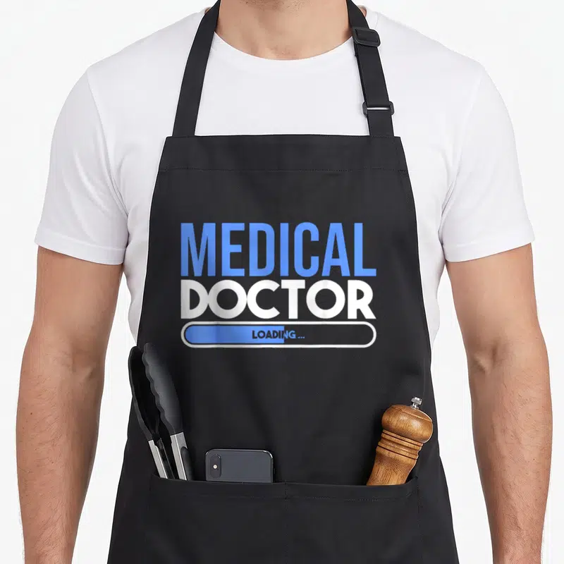 Tablier de cuisine noir avec inscription Medical Doctor et barre de chargement Loading en bleu et blanc.