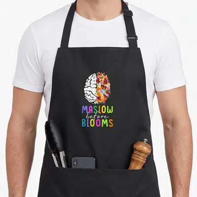 Tablier de cuisine noir avec illustration cerveau fleurie et texte Maslow before blooms multicolore